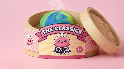 Rainbow Dumpling Squishy in its bamboo steamer box
