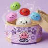 Squishy Dumpling Mystery Box being squeezed, soft slow-rise foam
