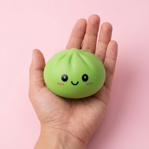 Matcha Green Dumpling Squishy held in hand, actual size