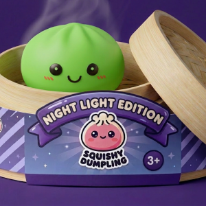Green Glow Dumpling Squishy Night Light in its bamboo steamer box