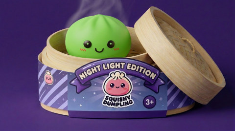 Green Glow Dumpling Squishy Night Light in its bamboo steamer box