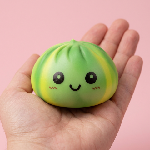 Green Tie Dye Dumpling Squishy held in hand, actual size