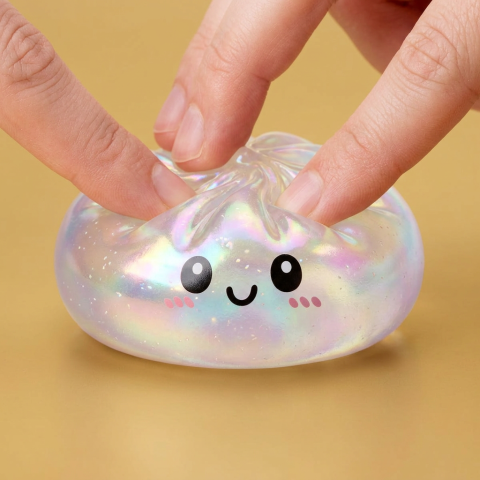 Iridescent Holographic Dumpling Squishy being squeezed, soft slow-rise foam