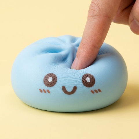 Giant Blue Dumpling Squishy being squeezed, soft slow-rise foam