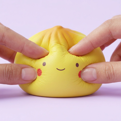Mini Dumpling Squishy Blind Box being squeezed, soft slow-rise foam