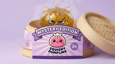Glitter Dumpling Squishy Rare Unicorn Edition in its bamboo steamer box
