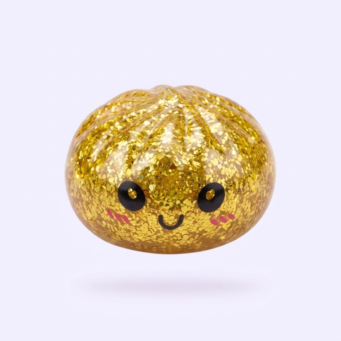 Mystery Glitter Dumpling Squishy Mini Set being squeezed, soft slow-rise foam