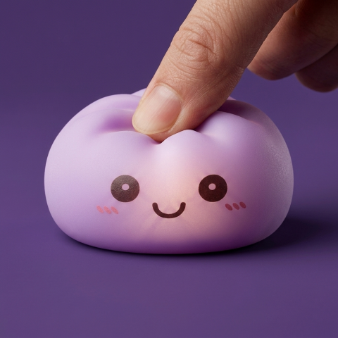 Mystery Squishy Dumpling Night Light being squeezed, soft slow-rise foam