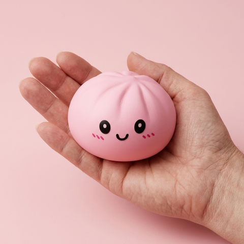 Pink Blossom Squishy Dumpling held in hand, actual size