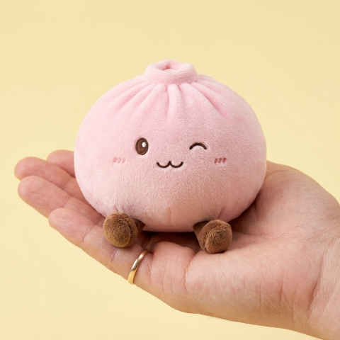 Giant Pink Squishy Dumpling Toy held in hand, actual size