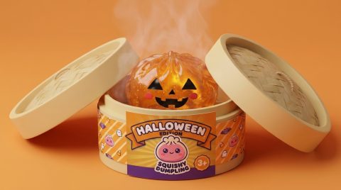 Light-Up Pumpkin Halloween Dumpling Squishy in its bamboo steamer box