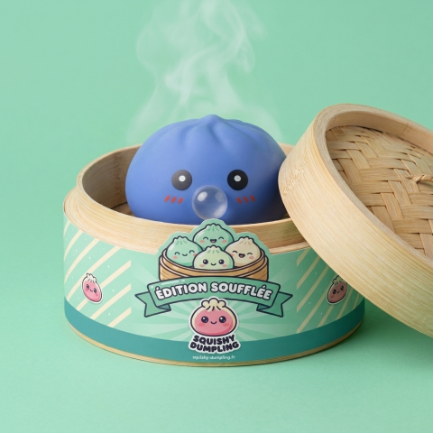 Puffy Purple Blow Dumpling Squishy in its bamboo steamer box