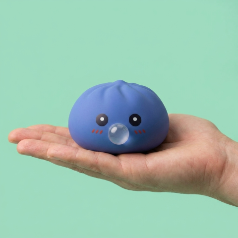 Puffy Purple Blow Dumpling Squishy held in hand, actual size