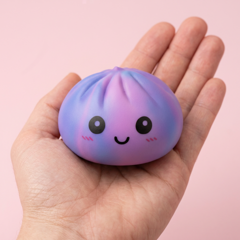 Violet Tie-Dye Dumpling Squishy held in hand, actual size