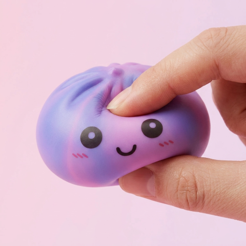 Violet Tie-Dye Dumpling Squishy being squeezed, soft slow-rise foam