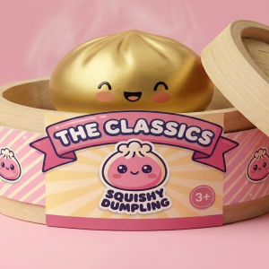Lucky Gold Dumpling Squishy in its bamboo steamer box