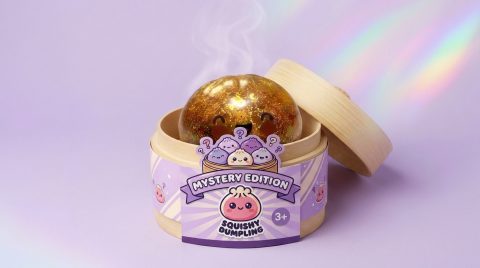 Squishy Bun Mystery Dumpling Surprise in its bamboo steamer box