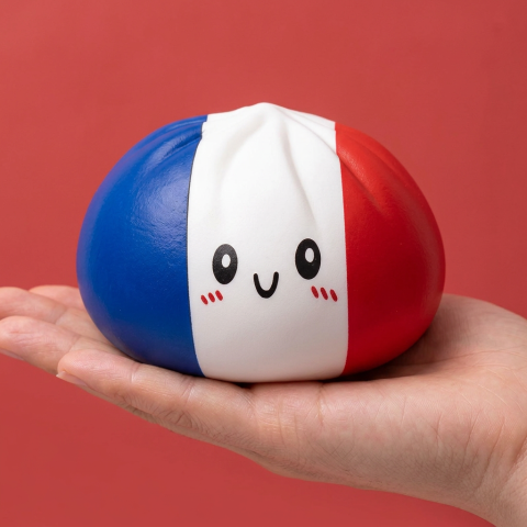France Flag Dumpling Squishy held in hand, actual size