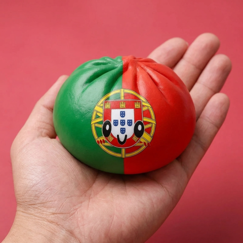 Portugal Flag Squishy Dumpling held in hand, actual size