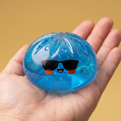 Sunglasses Dumpling Squishy held in hand, actual size
