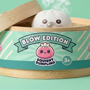 Giant Dumpling Squishy Cloud White in its bamboo steamer box