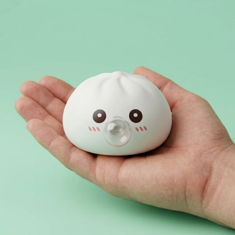 Giant Dumpling Squishy Cloud White held in hand, actual size