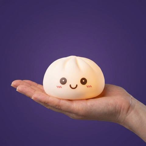Moonlight White Dumpling Squishy Night Light held in hand, actual size