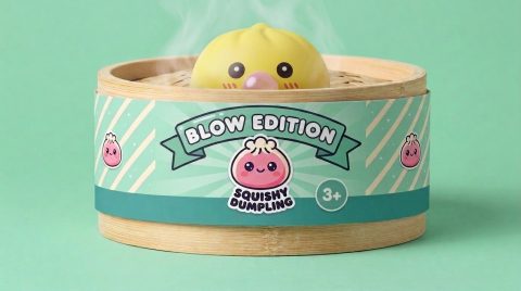 Jumbo Yellow Dumpling Squishy in its bamboo steamer box