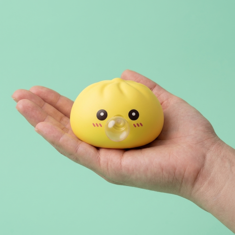 Jumbo Yellow Dumpling Squishy held in hand, actual size