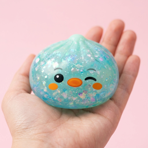 Frosted Mint Penguin Dumpling Squishy held in hand, actual size