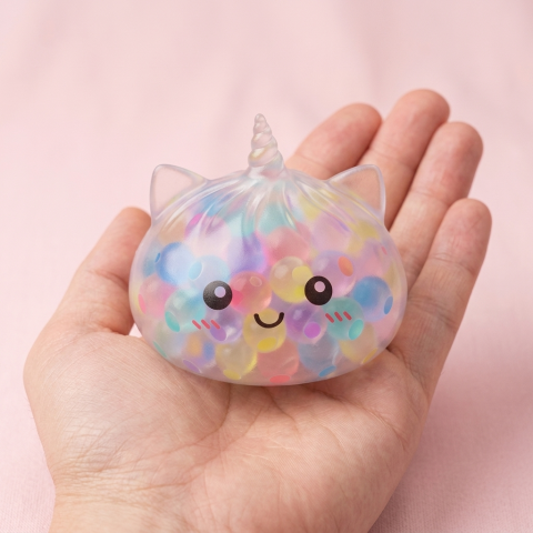 Pastel Unicorn Bubble Dumpling Squishy held in hand, actual size