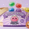 Unicorn Mystery Glitter Dumpling Squishy being squeezed, soft slow-rise foam