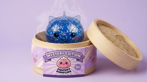 Unicorn Mystery Glitter Dumpling Squishy in its bamboo steamer box