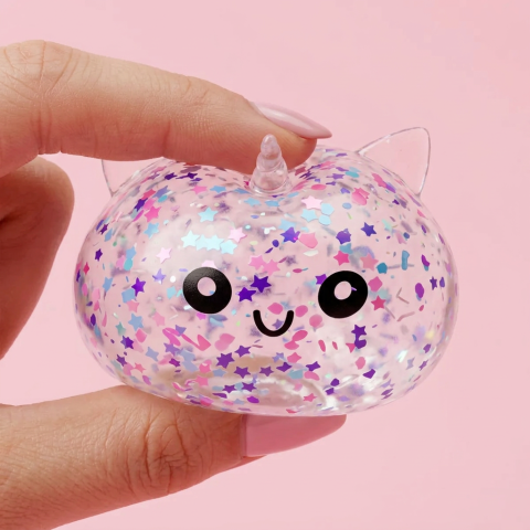 White Unicorn Sparkle Dumpling Squishy being squeezed, soft slow-rise foam