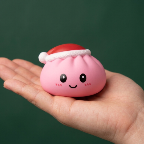 Christmas Hat Dumpling Squishy Set of 4 held in hand, actual size