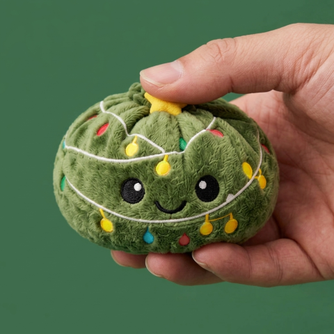 Twinkly Christmas Tree Dumpling Squishy being squeezed, soft slow-rise foam
