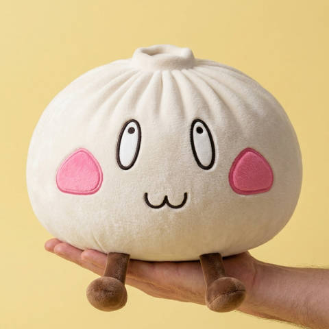 Giant Happy Face Dumpling Squishy held in hand, actual size