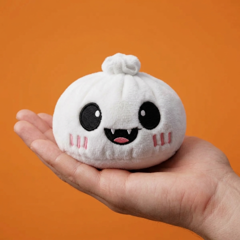Moonlit Ghost Halloween Dumpling Squishy held in hand, actual size