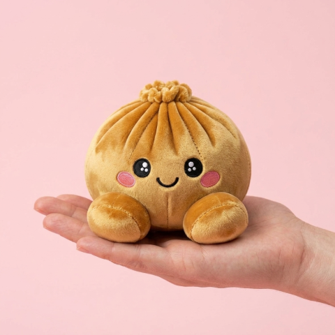 Royal Gold Dumpling Squishy held in hand, actual size