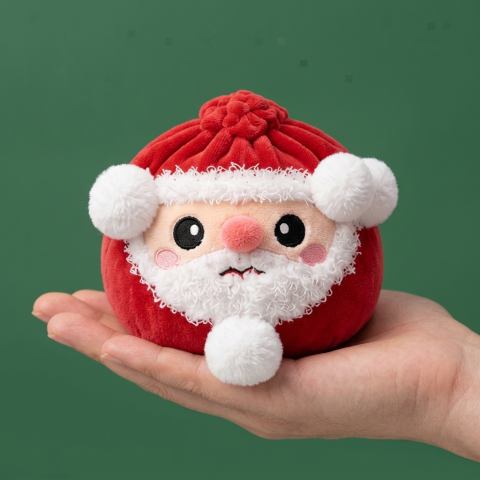 Santa Dumpling Squishy Plush held in hand, actual size