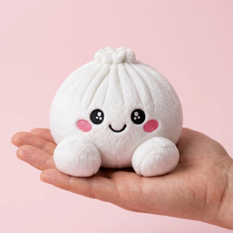 Marshmallow White Dumpling Squishy Plush held in hand, actual size