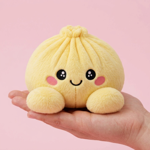 Lemon Yellow Dumpling Squishy held in hand, actual size